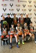 Harry Garewal with the Phoenix Warriors youth basketball team after a tournament