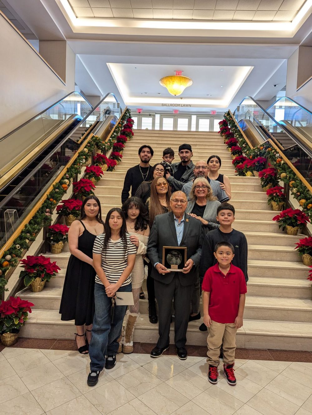 Harry Garewal with family at an award event in December 2024